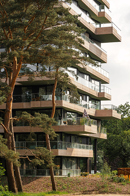 orange architects beaufort 13 tower on hilly landscape